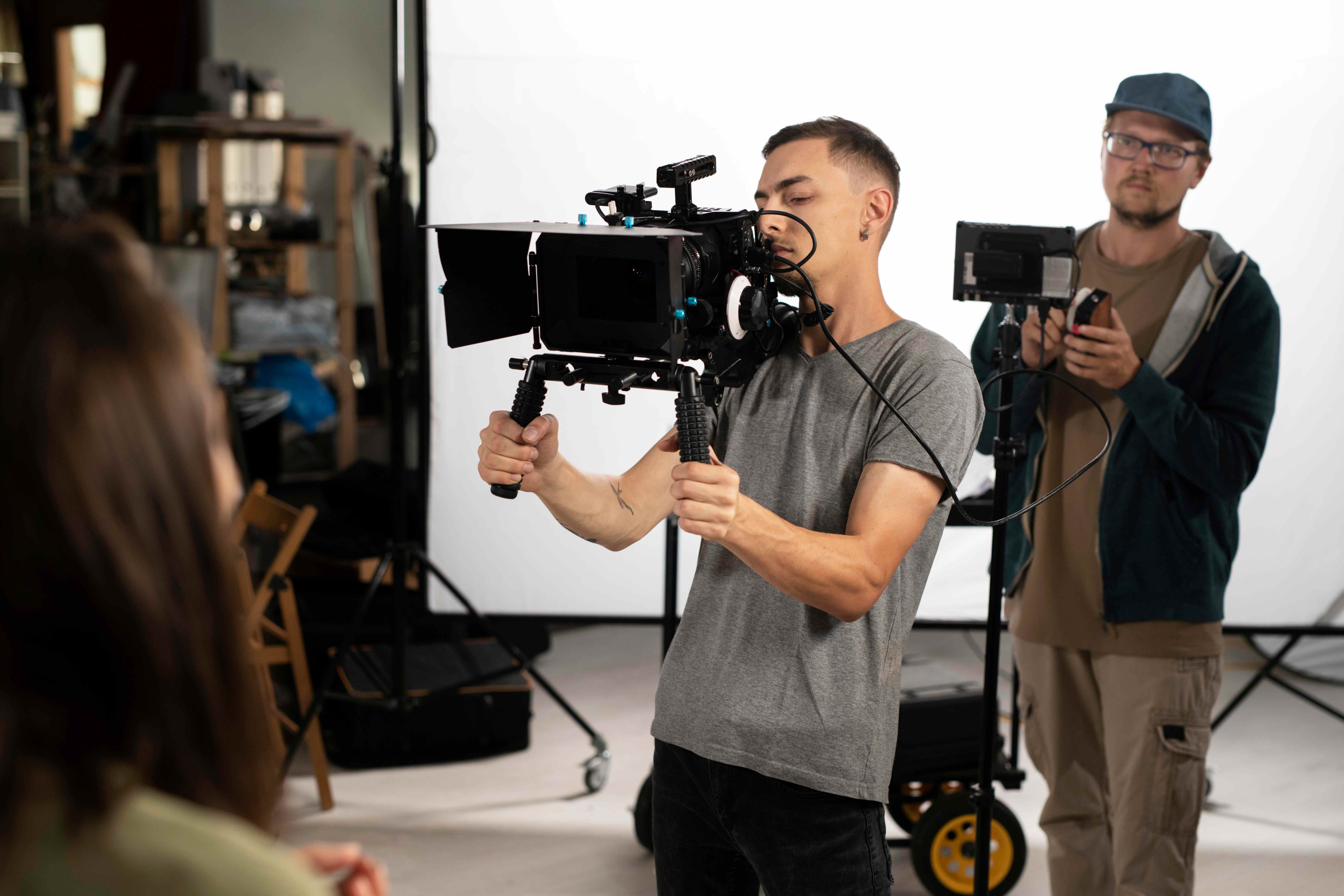 man-filming-with-professional-camera-new-movie_11zon.jpg